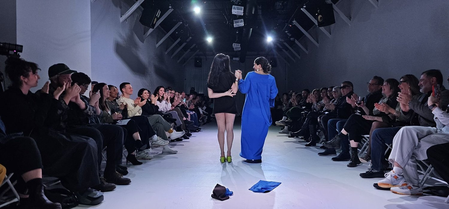 Interweave performed in front of a seated audience.